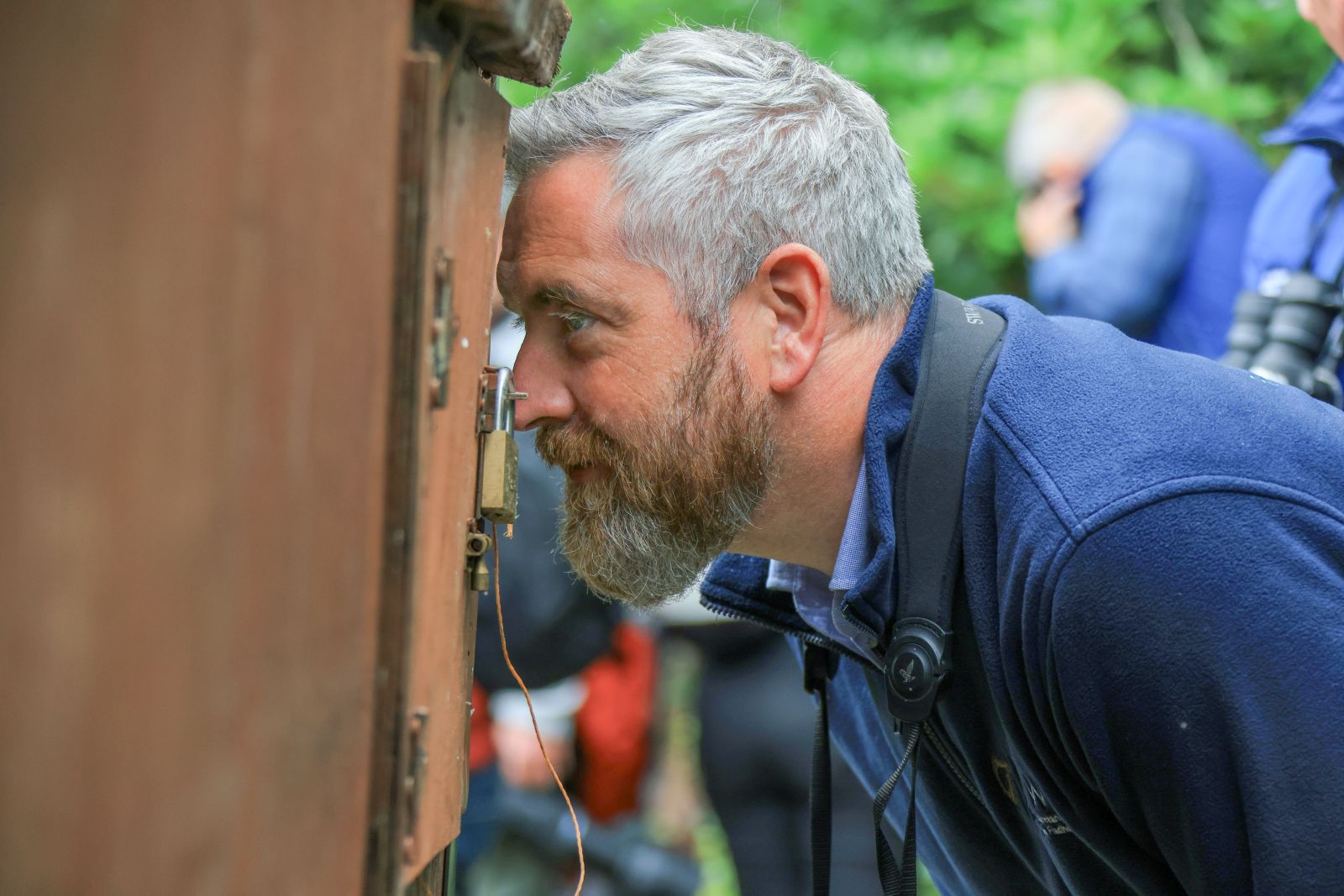 Minister O Sullivan looking in cage