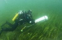 Photo of diver doing underwater survey